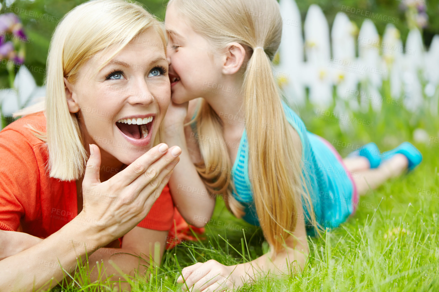 Buy stock photo Cute, whisper and child with mom, outdoor and wow for gossip, rumor and telling of secret to woman. Home, sneaky and girl with news for mother, backyard and surprised with information and family