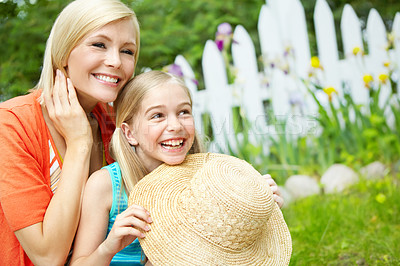 Buy stock photo Cute litte girl sitting on the grass outdoors with her mom