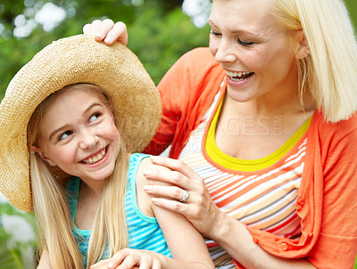 Buy stock photo Cropped shot of a little girl and her mother in the front yard