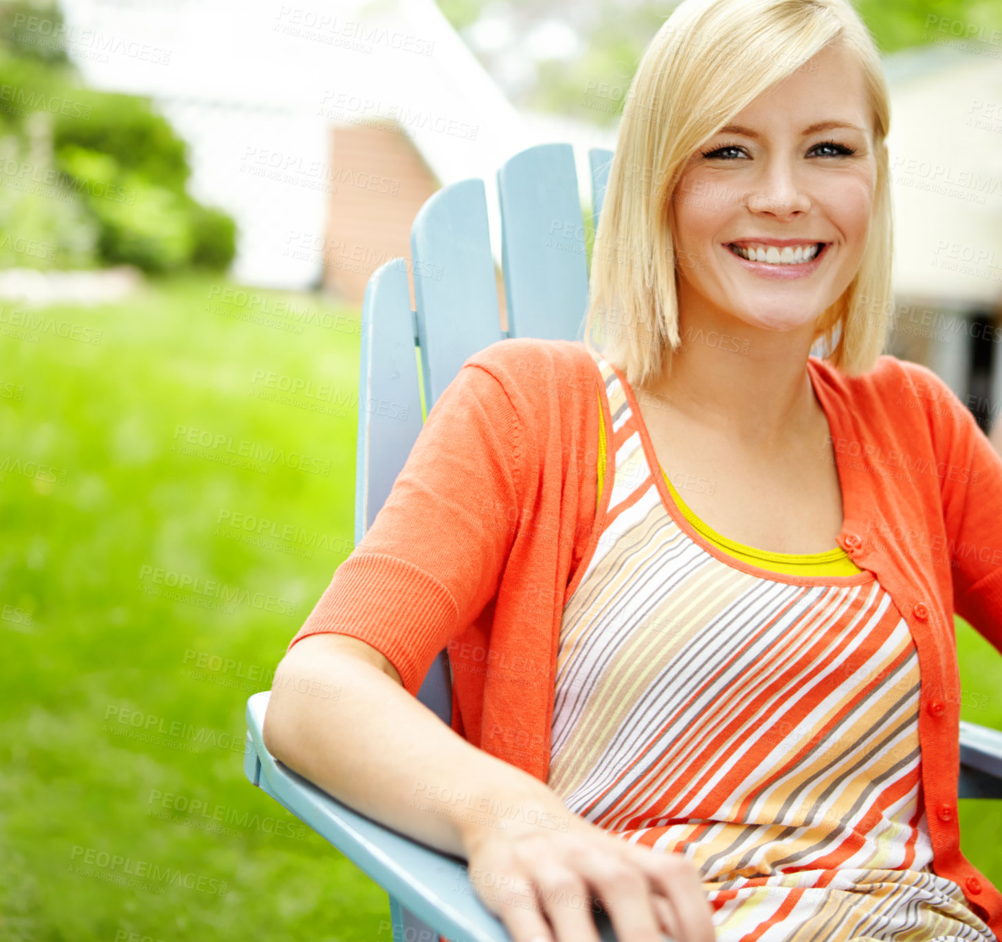 Buy stock photo Cropped view of a pretty woman relaxing in a deckchair outdoors