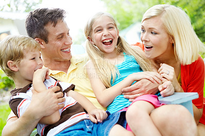 Buy stock photo Happy young family spending time together outdoors