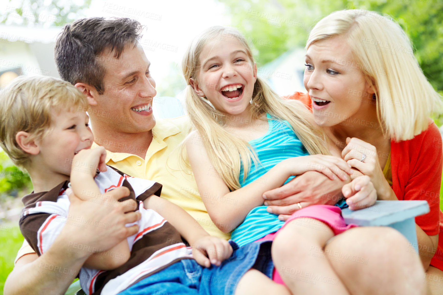 Buy stock photo Happy young family spending time together outdoors