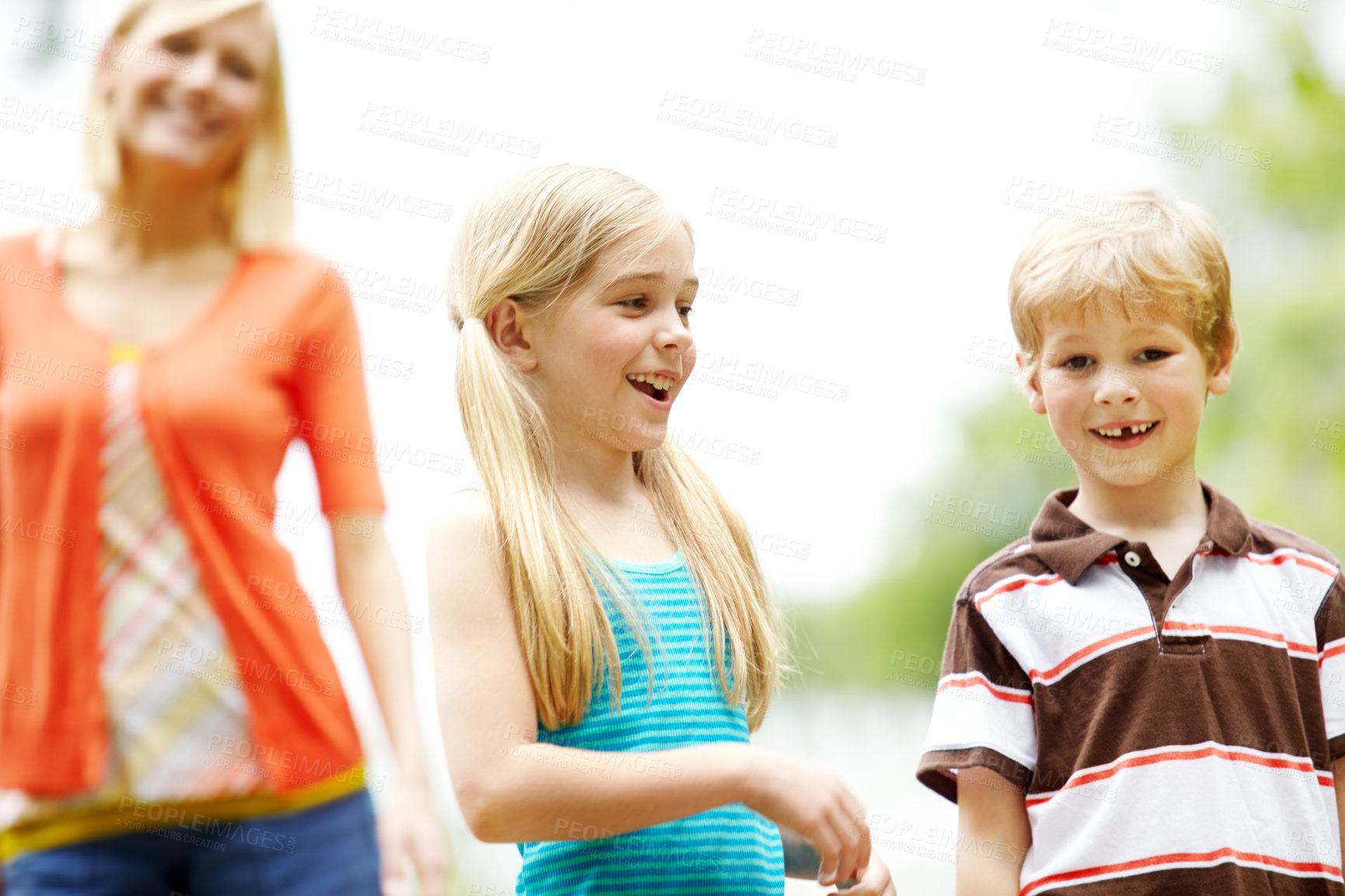 Buy stock photo Two cute young children spending time outdoors with their mother