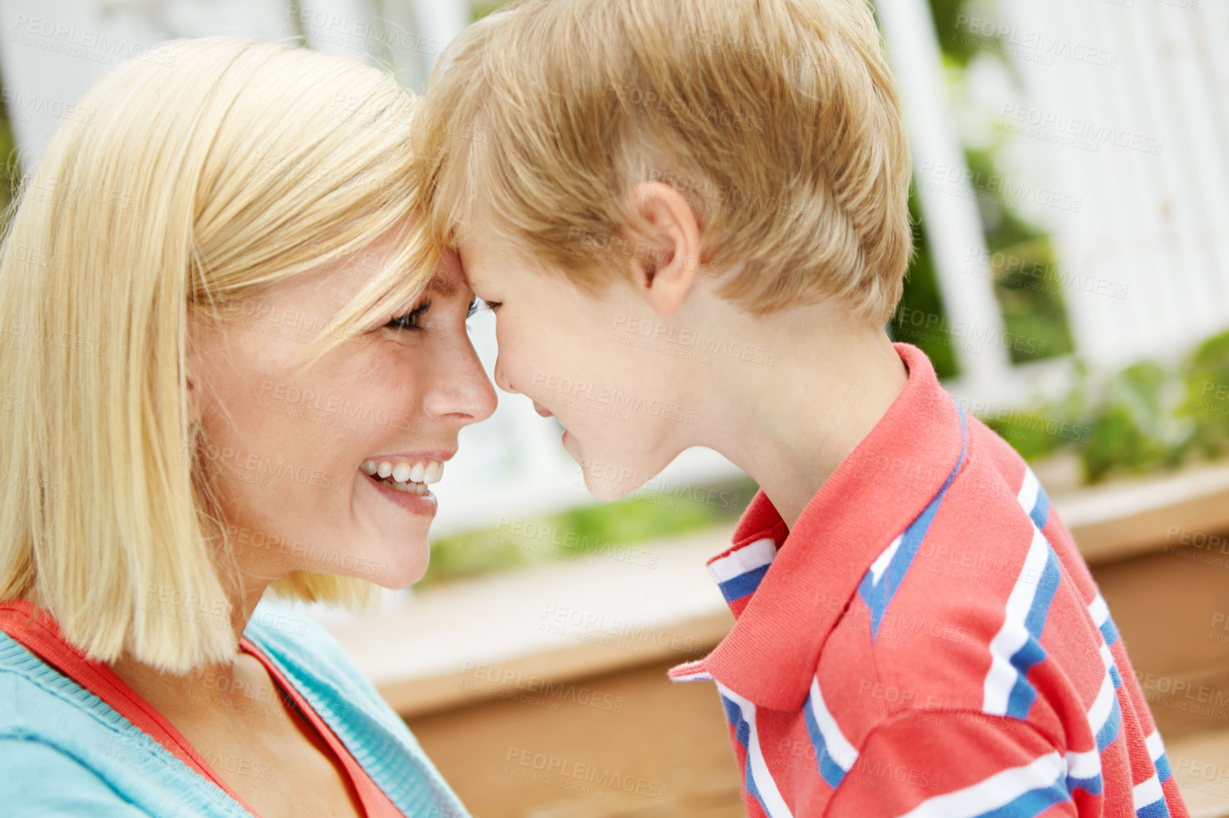 Buy stock photo Embrace, mother and child outdoor on deck by stairs with happy, smile and summer fun on holiday. Garden, together and patio with love, care and support with laugh and forehead touch with bonding