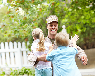 Buy stock photo Outdoor, soldier and smile for children, hug and excited for reunion, dad and hero with love or kids. Family, father and parent from military, embrace and care for boy, girl and man after war or home