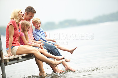 Buy stock photo Family, holiday and water with mockup and foot at lake during the summer for travel with love. Child, parent and adventure at river on deck with freedom to relax with space and time for lifestyle.