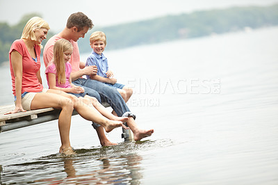 Buy stock photo Holiday, lake and family with kids with foot in water during summer vacation in the outdoor with space. Deck, parent and child at an adventure together with sunshine and freedom to travel in mock up.