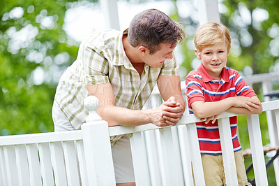 Buy stock photo Home, boy and smile with father on balcony for support, bonding and care in Canada. People, parent and happy with kid as family on break with love, trust and relax for child growth and development