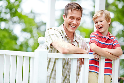 Buy stock photo A young boy and his father sharing some quality time together on the porch