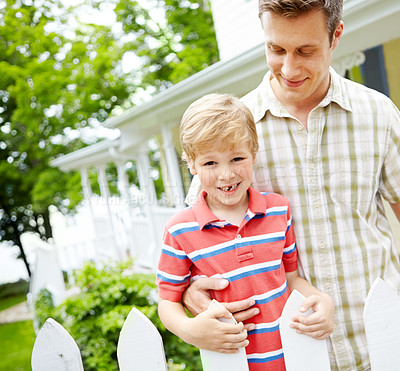 Buy stock photo Garden, hug and smile of father with son outdoor together for bonding, support or trust. Family, happy or love with single parent man and boy child in backyard of home for development or security