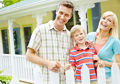 Buy stock photo Happy young family standing together outdoors