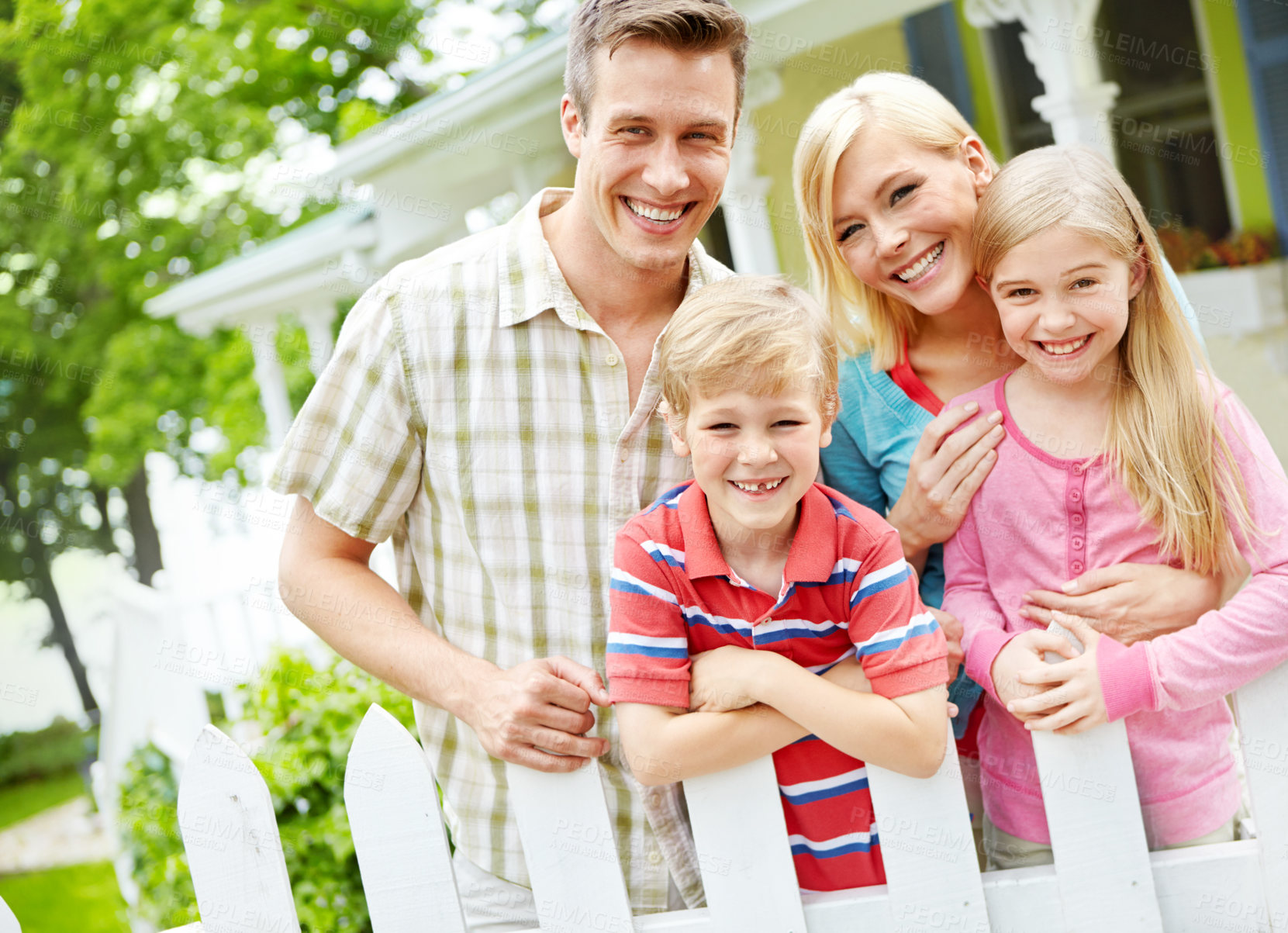 Buy stock photo Family, happy or portrait in garden for new home, investment opportunity or care in Australia. Parents, children or hug at fence with love, property security or excited for relocation to neighborhood