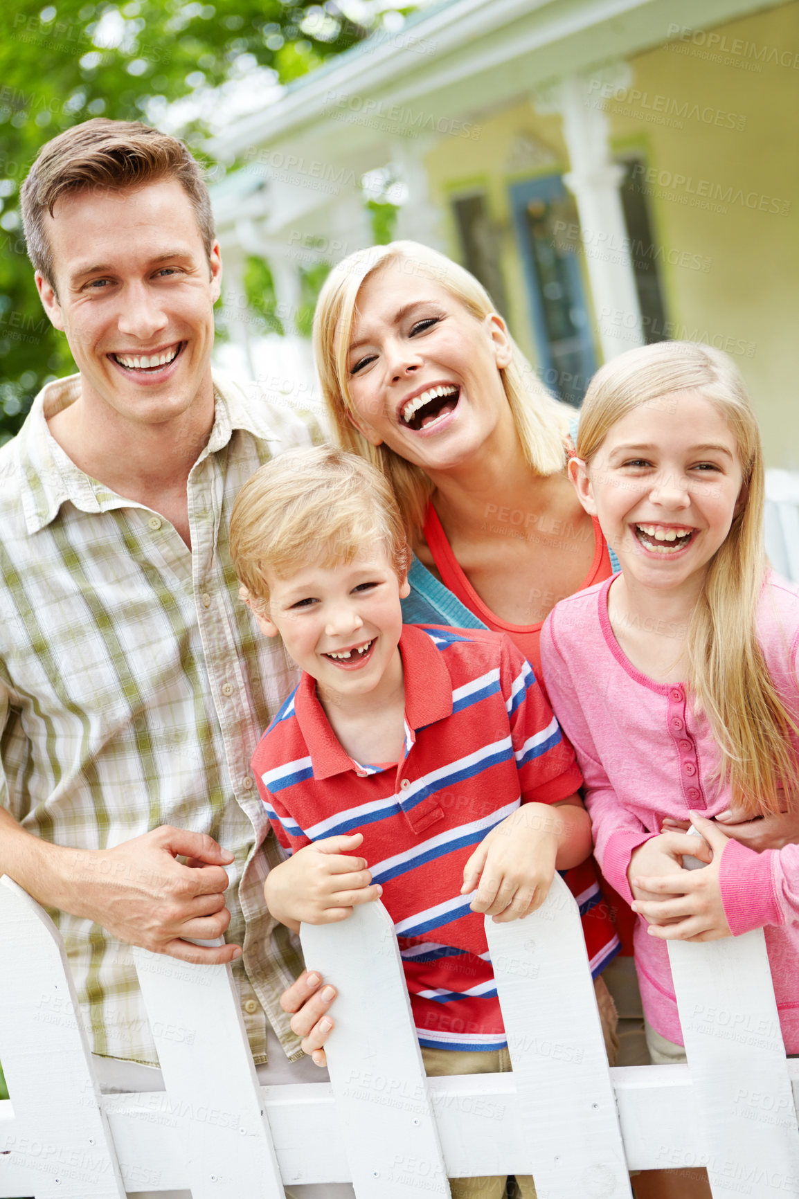 Buy stock photo Happy, family and portrait with new home, hug and excited outdoor with property investment and bonding. Love, support and care of mother, father and children with youth and fence with smile together