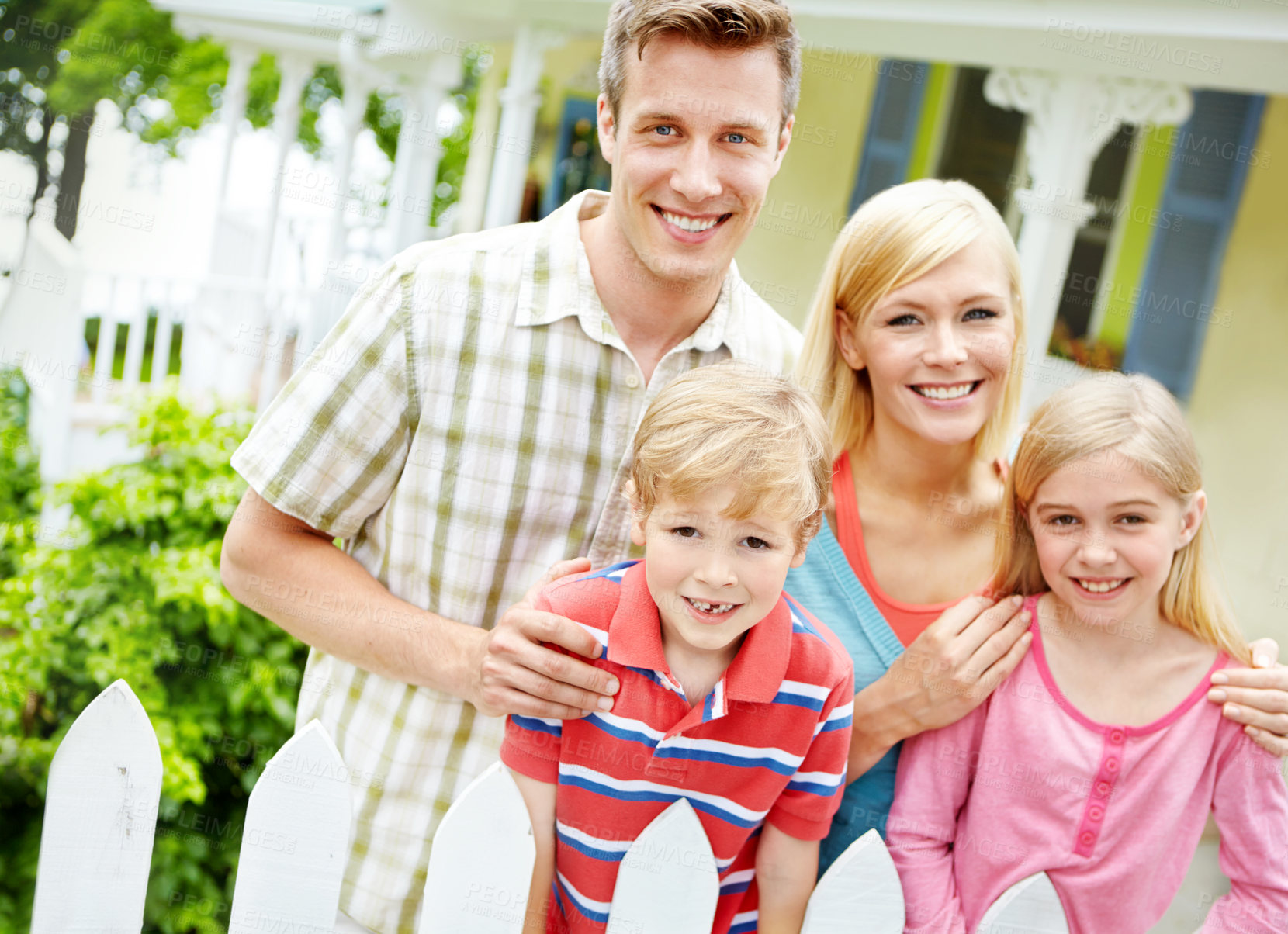 Buy stock photo Shot of a young family of four outside