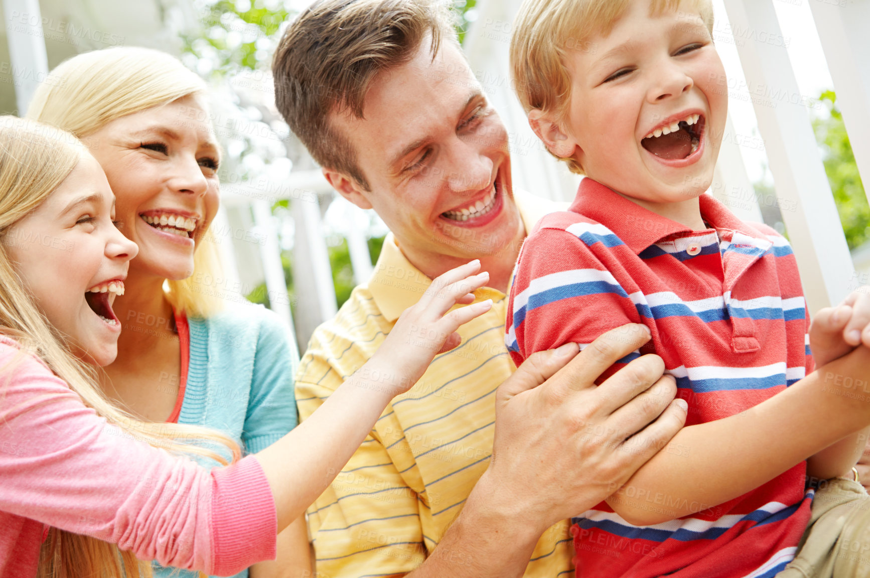 Buy stock photo Shot of a young family of four outside