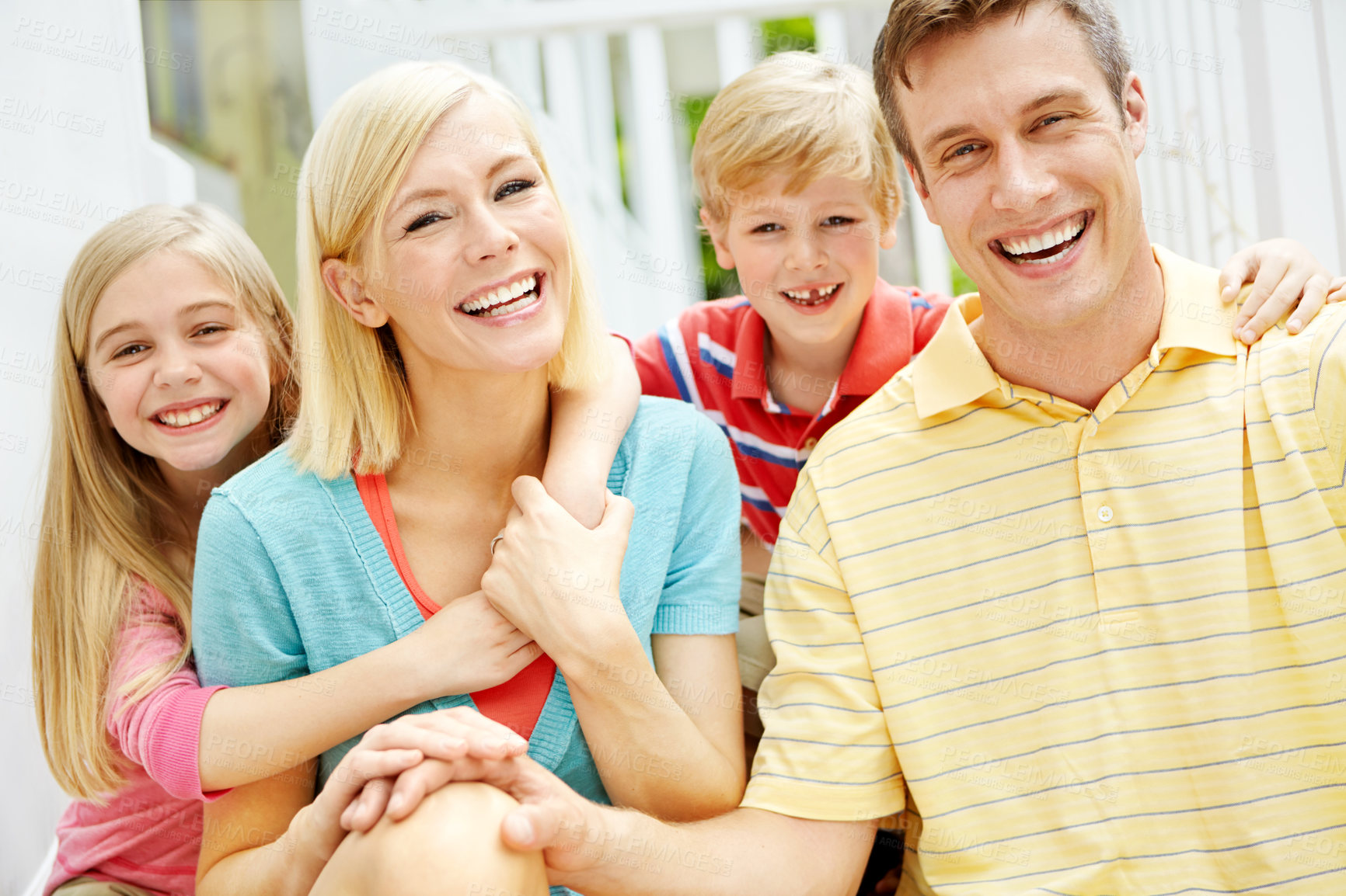 Buy stock photo Shot of a young family of four outside