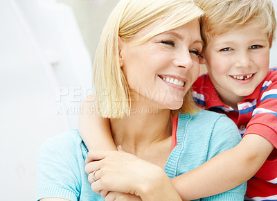 Buy stock photo Cute little boy spending some time with his mom