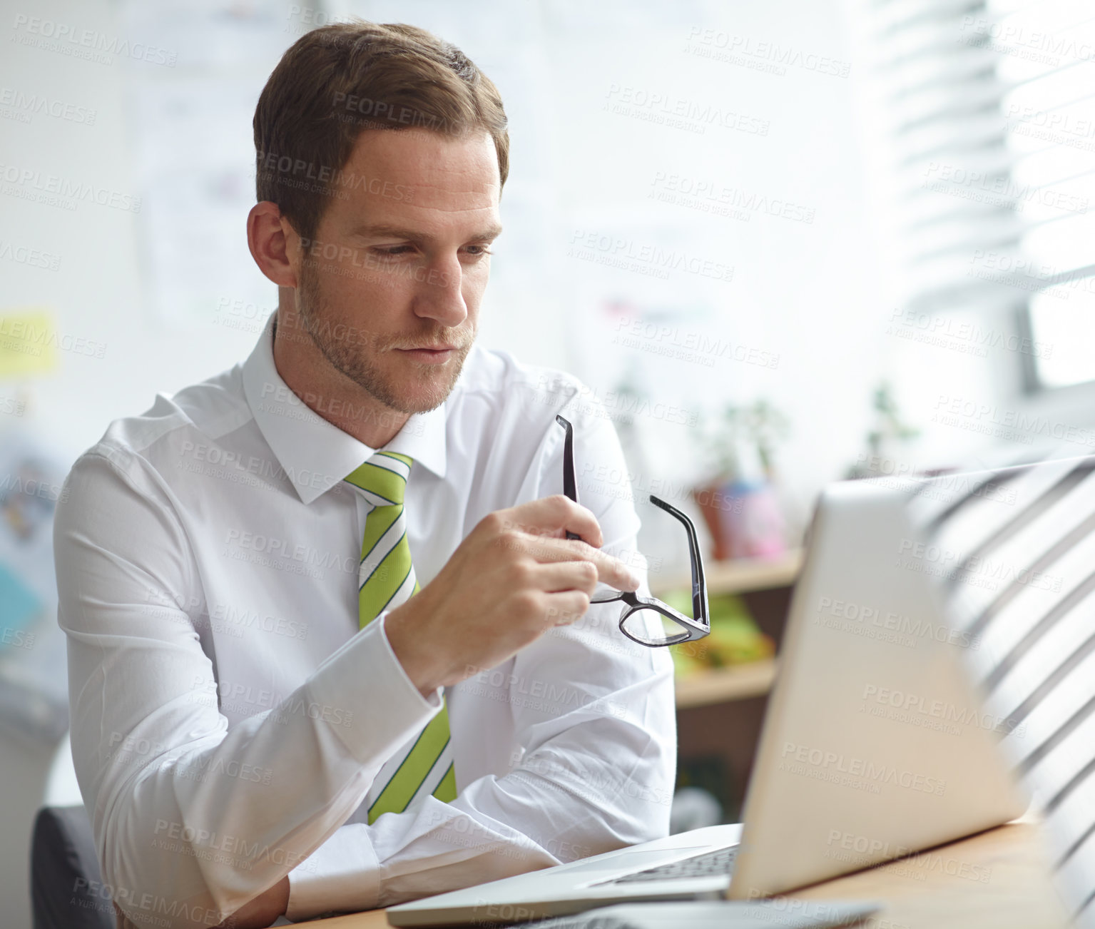 Buy stock photo Thinking, glasses and business man on laptop in office for brainstorming, problem solving and solution. professional, corporate and person on computer for planning, research proposal and internet