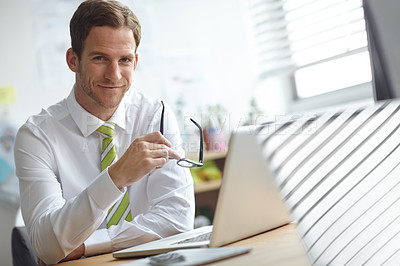 Buy stock photo Portrait, glasses and business man on laptop in office with confidence, company pride and smile. Professional, corporate and person on computer for planning, research proposal and project review