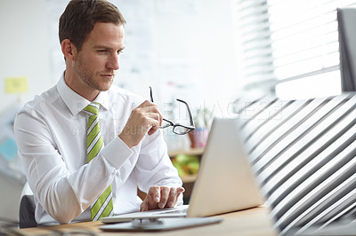 Buy stock photo Reading, glasses and business man on laptop in office for website search, online project and b2b email. Professional, corporate and person on computer for planning, research proposal and internet