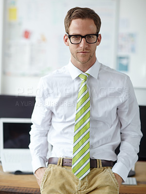 Buy stock photo A young businessman looking at the camera