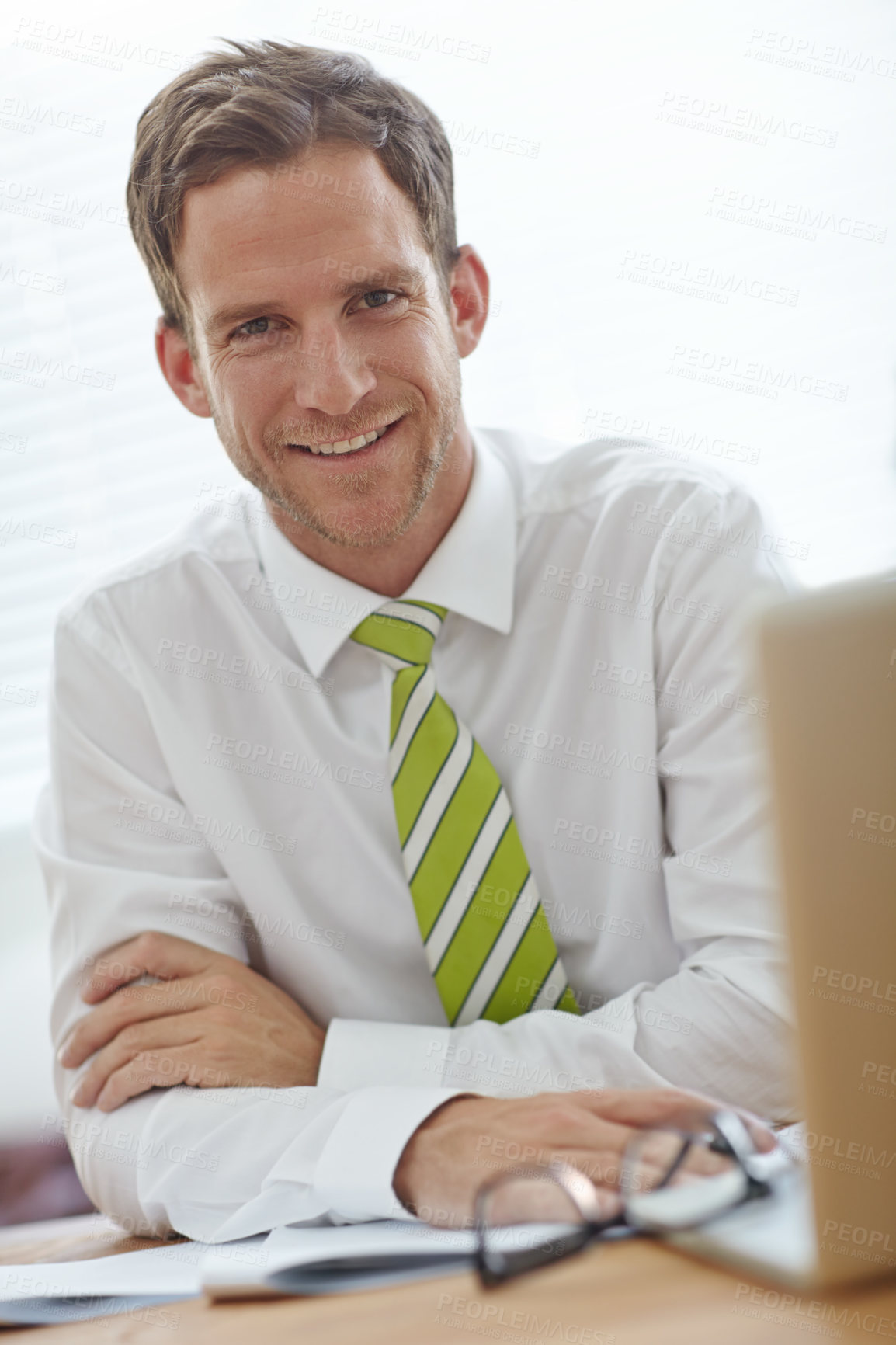 Buy stock photo Man, laptop and smile with portrait in office for story, proposal or excited at media company. Person, writer and happy by computer for editing, article or pride with review at news agency in Spain