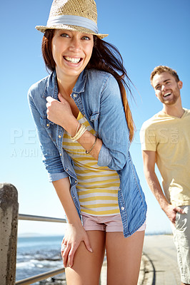 Buy stock photo Portrait, date and vacation with a couple on the promenade, walking together for summer romance. Nature, beach and blue sky with a man and woman enjoying a walk while bonding, dating or on holiday