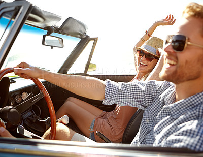 Buy stock photo Car road trip, travel and laughing couple on bonding holiday adventure, transportation journey or fun summer vacation. Love flare, convertible automobile and driver driving on Canada countryside tour