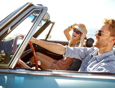 Buy stock photo Car road trip, travel and happy couple laughing on holiday bond adventure, transportation journey or fun summer vacation. Love flare, convertible vehicle and driver driving on Canada countryside tour