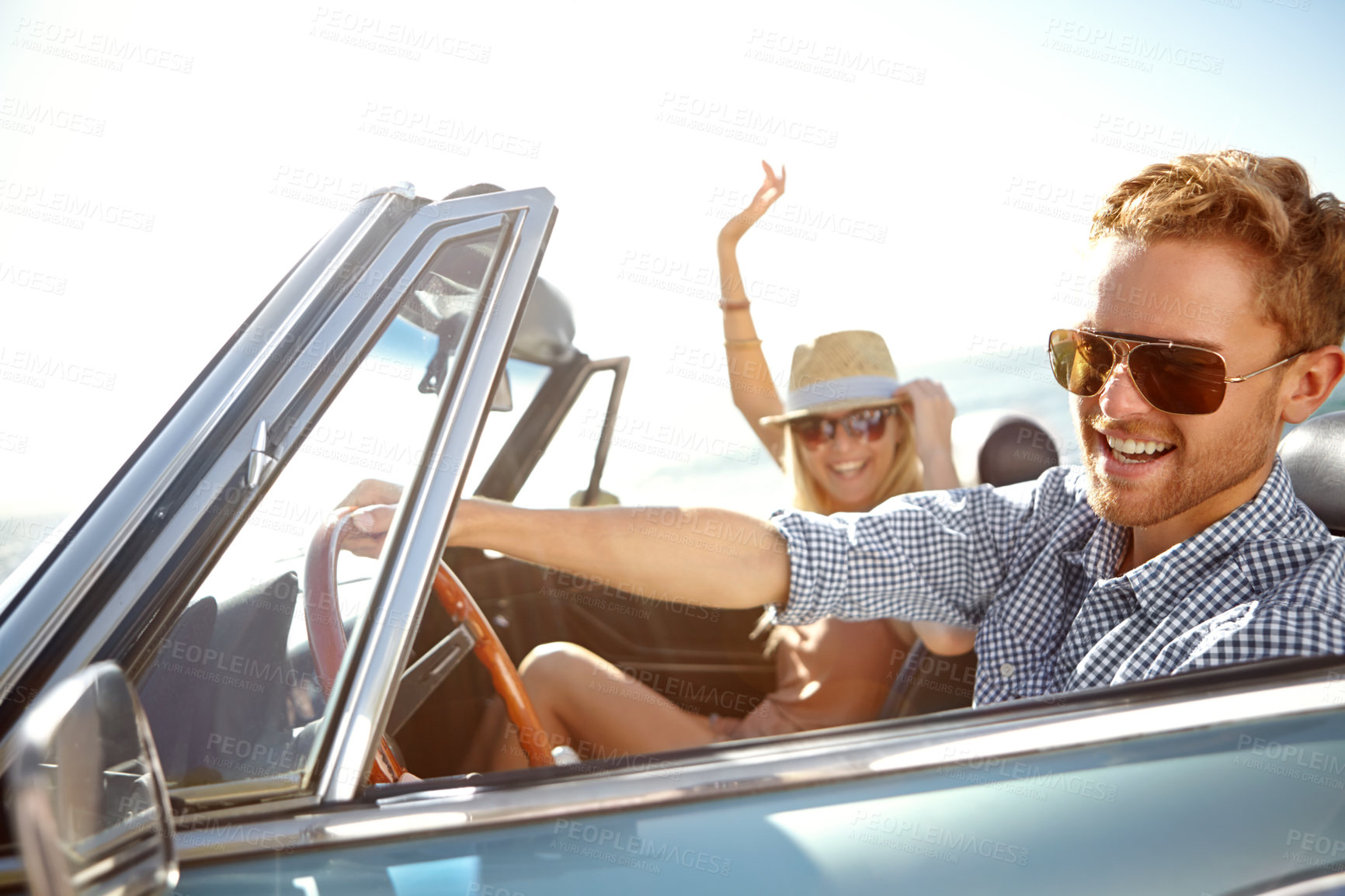 Buy stock photo Car road trip, happy travel and couple on bonding holiday adventure, transportation journey or fun summer vacation. Love flare, convertible automobile and driver driving on Canada countryside tour