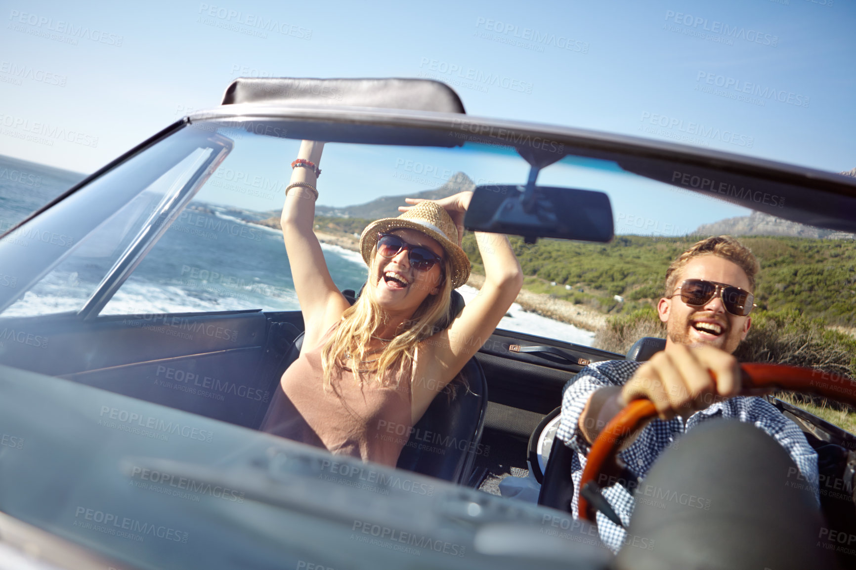Buy stock photo Car road trip, travel and happy couple on ocean holiday adventure, transportation journey or fun summer vacation. Love bond, convertible automobile and driver driving on Australia countryside tour