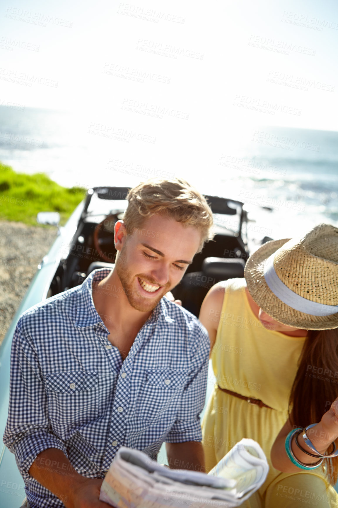 Buy stock photo Road trip, adventure and couple with map by ocean on summer holiday, vacation and weekend getaway on car. Travelling, freedom and man and woman reading paper for directions, navigation and journey