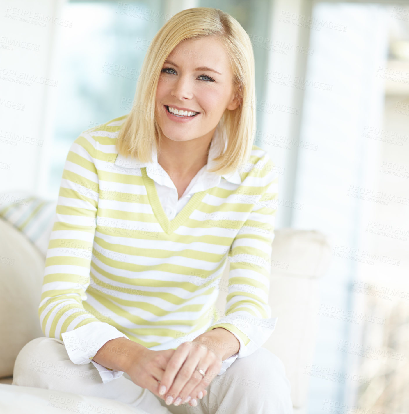 Buy stock photo Shot of a beautiful blonde woman relaxing at home