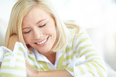 Buy stock photo Shot of a beautiful blonde woman relaxing at home