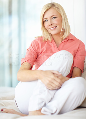 Buy stock photo Shot of a beautiful blonde woman relaxing at home