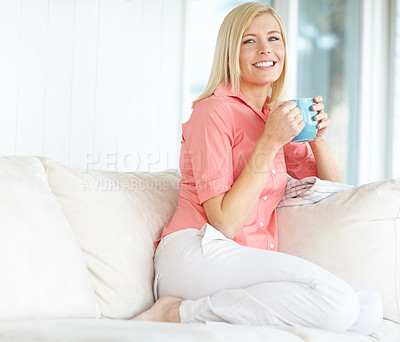 Buy stock photo Portrait, drinking coffee and happy woman on sofa for peace, relax and calm in home apartment. Smile, cup and blonde person with beverage in lounge for energy, morning latte or comfort in New Zealand