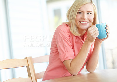 Buy stock photo Shot of a beautiful blonde woman relaxing at home