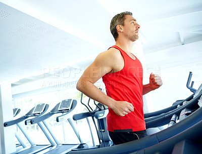 Buy stock photo Athlete, fitness and running with treadmill for marathon, workout or cardio training in gym. Man, exercise or sports person ready with equipment for endurance, speed goals or wellness in health club