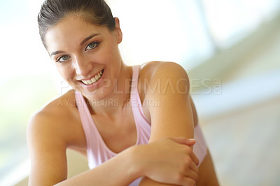 Buy stock photo A happy young woman sitting in an exercise class and smiling