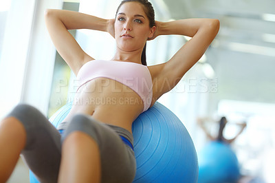 Buy stock photo Two people doing exercises on Swiss balls at the gym
