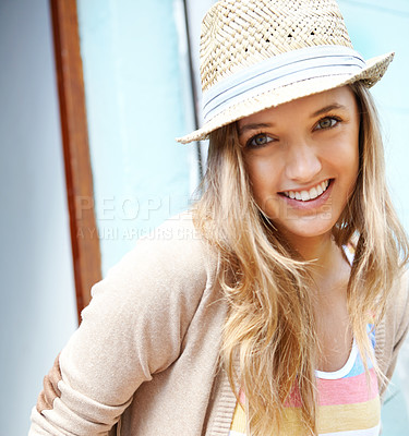 Buy stock photo Closeup of a beautiful young woman wearing a sunhat and smiling at the camera