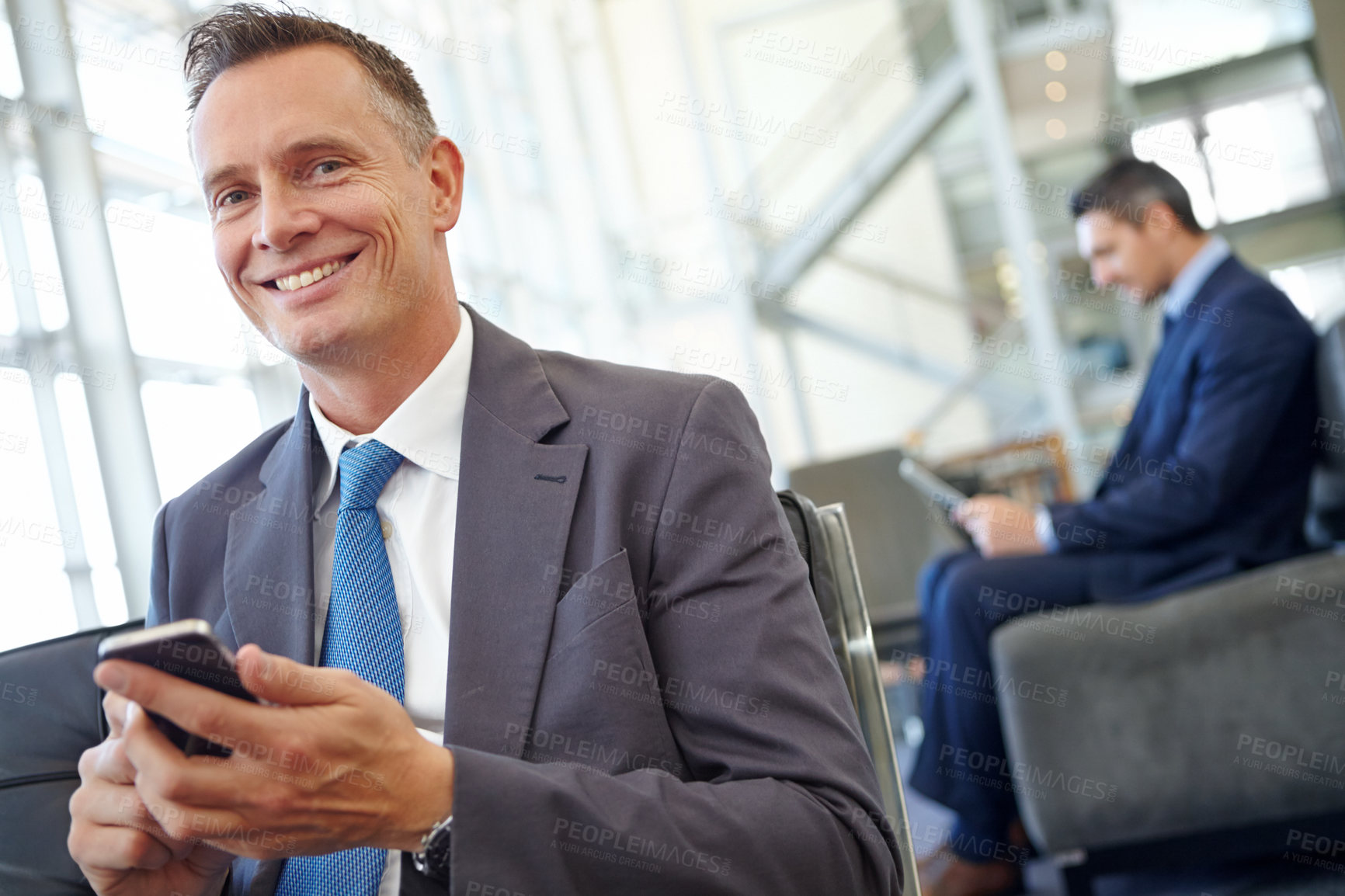 Buy stock photo Smile, corporate or businessman with phone for invest strategy, finance growth or financial blog news. Travel, happy or CEO in airport lobby for social media, networking or internet website review