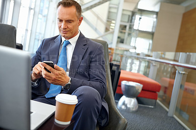 Buy stock photo Businessman, laptop and smartphone with senior and ceo company communication or social media with coffee. Contact, online and email with networking, b2b and worker in professional corporate lounge