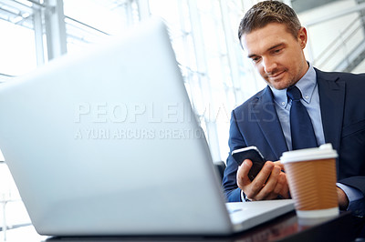 Buy stock photo Businessman, laptop and smartphone with company communication or social media with coffee while working. Contact, online and email with networking and worker in professional corporate lounge