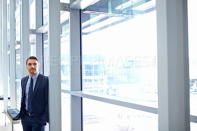 Buy stock photo Vision, mindset and window with a business man at work, standing in his office while thinking of an idea. Corporate, growth and future with a male employee leaning against a glass wall while working