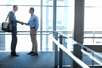 Buy stock photo Business men, handshake and partnership deal in hotel lobby, modern office or airport lounge in CRM team meeting. Corporate people, employees and shaking hands in collaboration, agreement or success