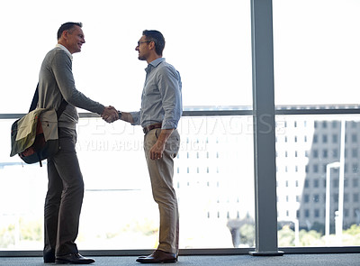 Buy stock photo Mature business people, handshake or partnership deal in airport lounge, hotel lobby or modern office for financial crm. Smile, happy or corporate men shaking hands in welcome, thank you or greeting