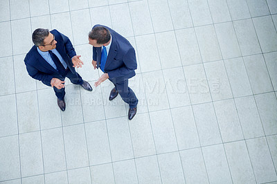 Buy stock photo Corporate, top view and business people talking for planning company strategy, finance growth and financial review. Teamwork, meeting or staff in lobby for collaboration, data analysis or idea search