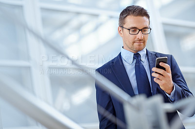 Buy stock photo Networking, corporate or business man with phone for internet research, social media at hotel lobby before trip to an airport. Tech, online or ceo in on smartphone for travel blog review or app