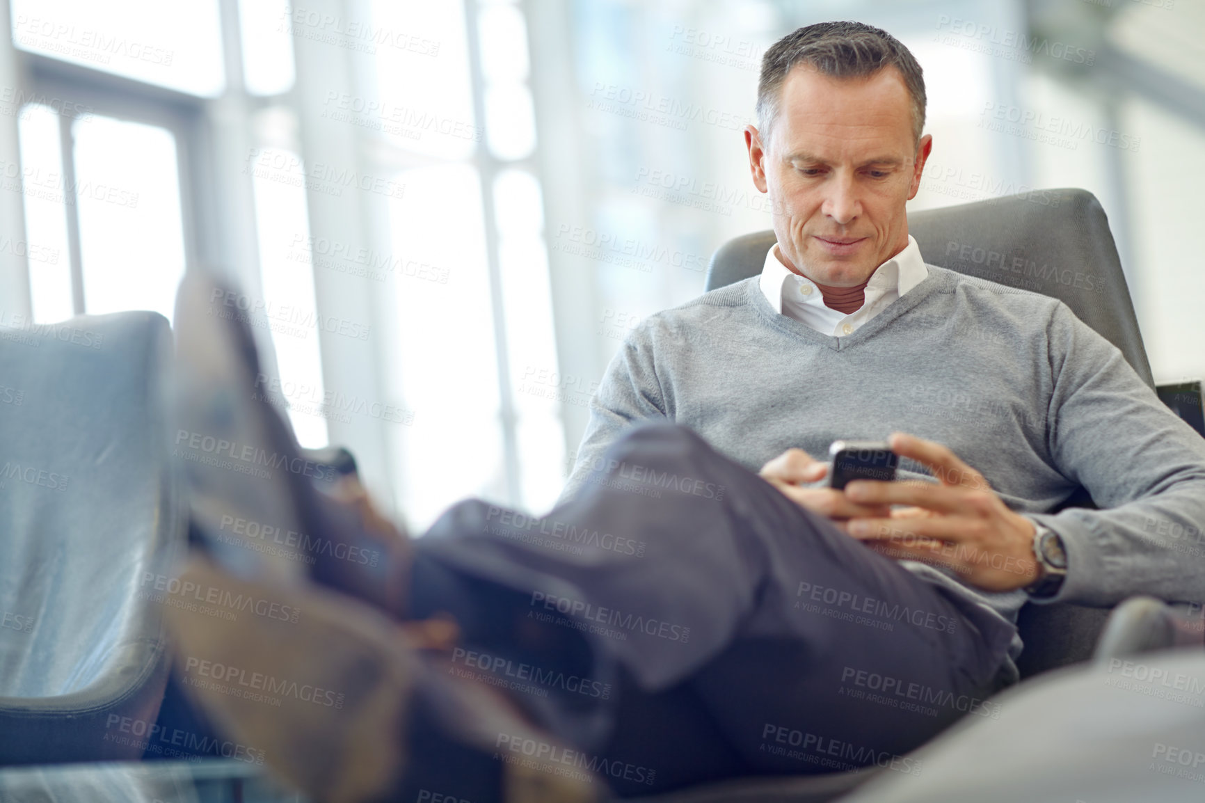 Buy stock photo Relax, travel or business man with phone for invest, finance growth or financial review. CEO, airport lobby or manager on smartphone for planning, data analysis or economy data web research